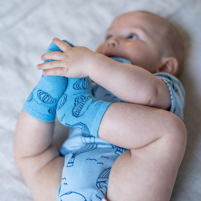 Baby wearing blue hot aire balloon socks 