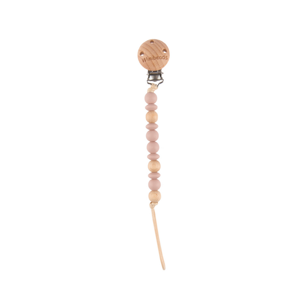 Dusty Pink Beaded pacifier clip with wooden top on a white background