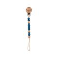 Wooden pacifier clip with blue beads on a white background
