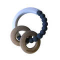 Teething ring with wooden and silicone components on a white background